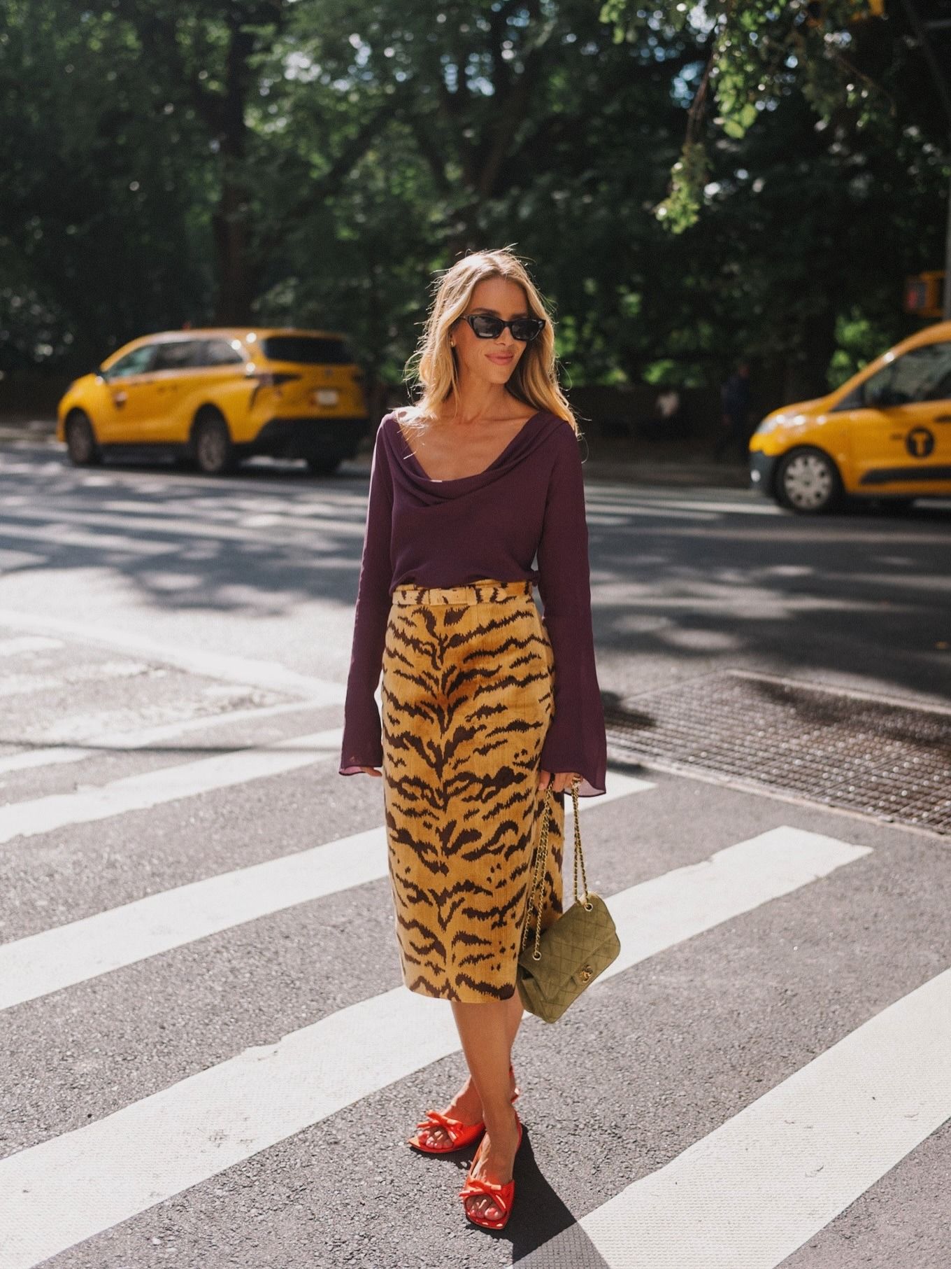 Woman wearing a tiger-print skirt.