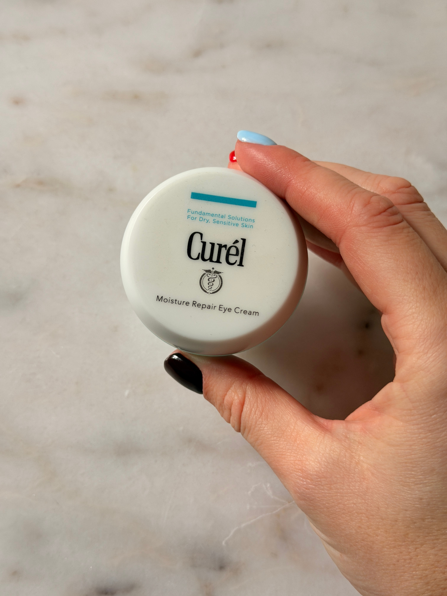 Freelance beauty editor Grace Day holding the Curel eye cream