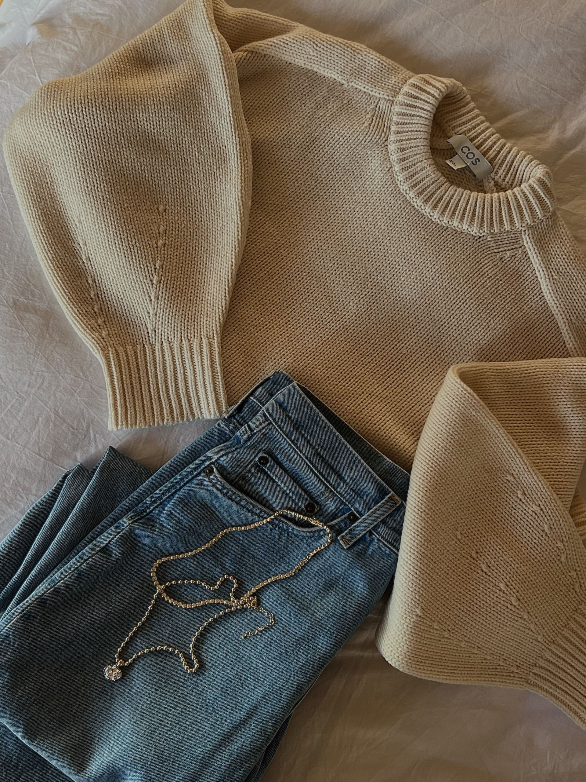 COS round neck jumper and blue jeans