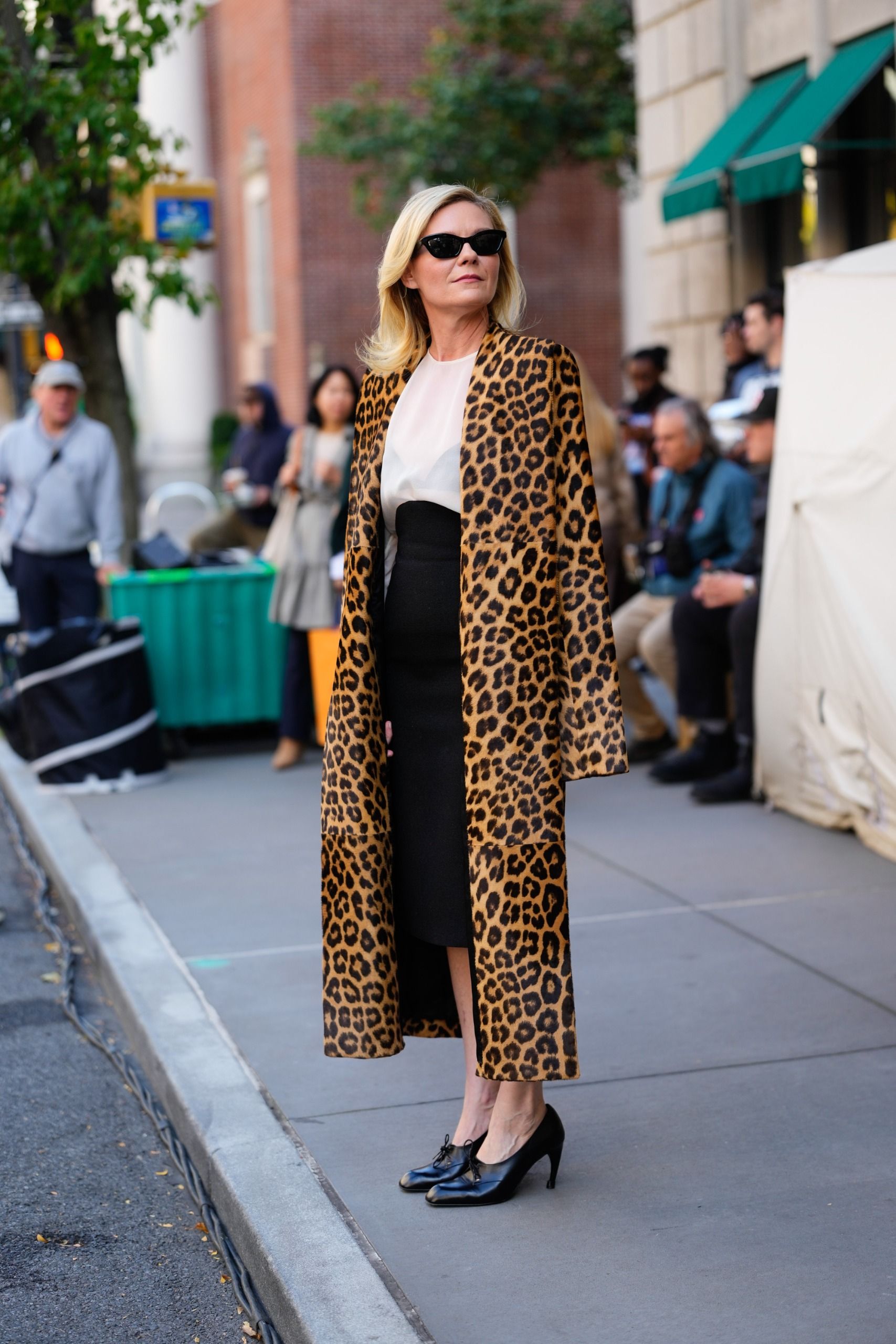 Kirsten Dunst on the set of The Housemaid's Secret wearing a leopard coat