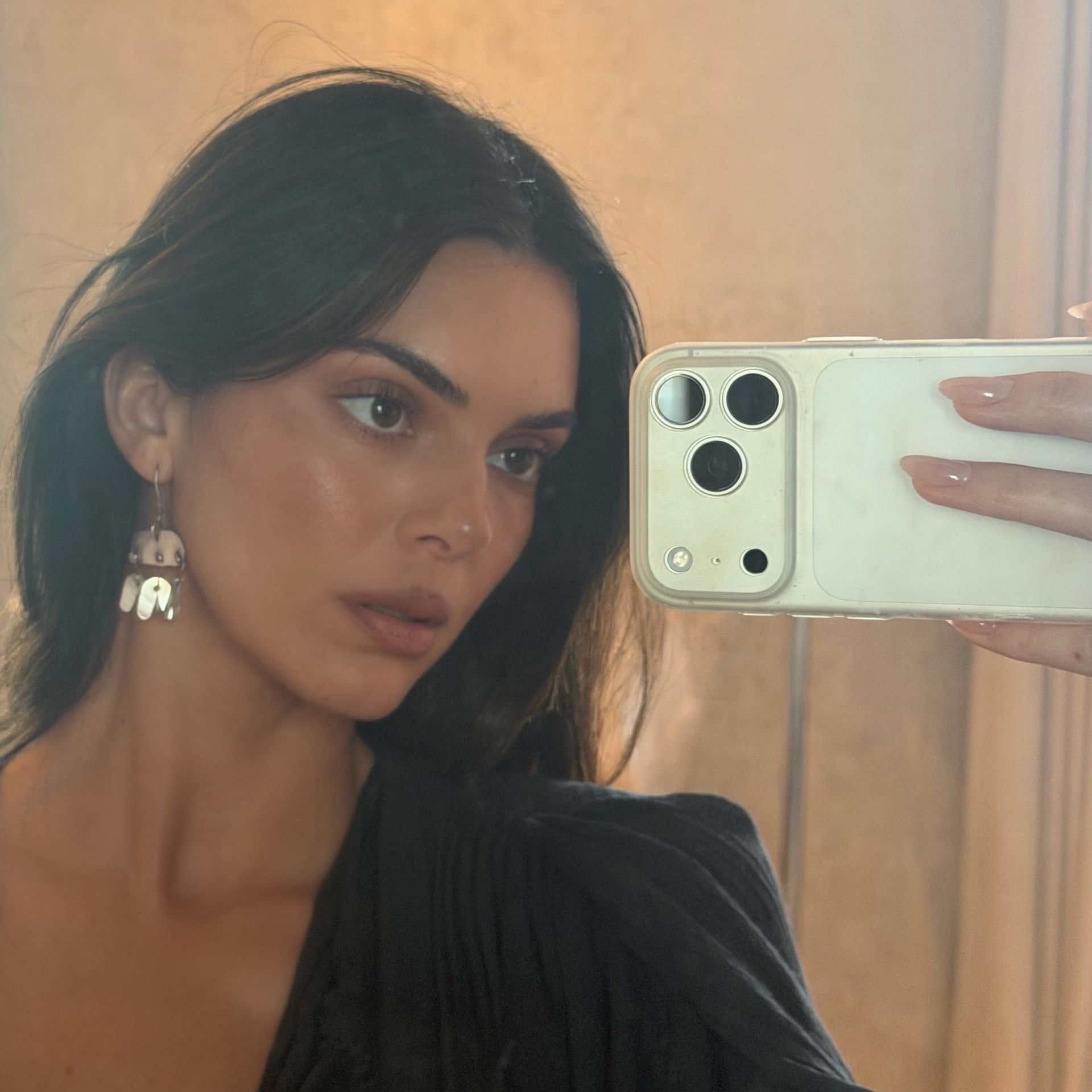 Kendall Jenner taking a selfie wearing OPI Put It in Airplane Mode