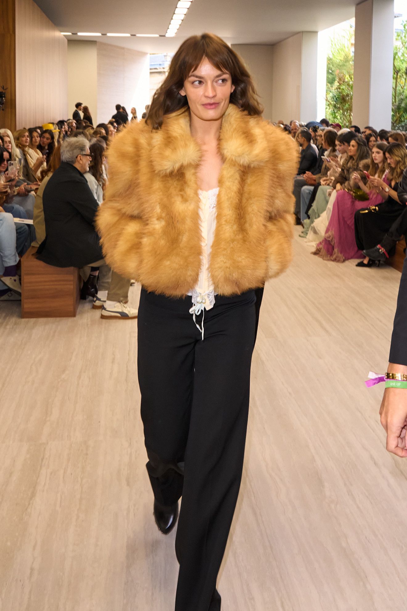 Britt Lower arrives at the Chloé spring/summer 2027 runway during Paris Fashion Week