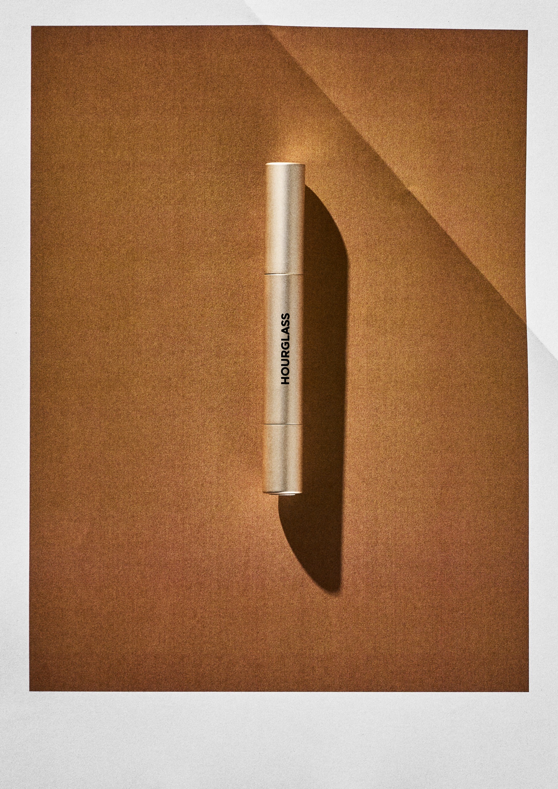 Hourglass Phantom Blur Balm on an orange background