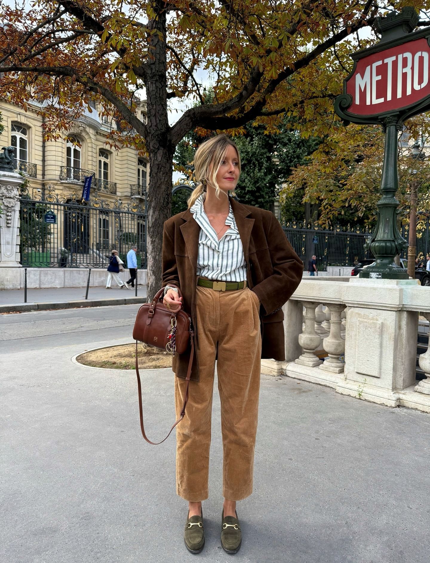 Woman wearing tan velvet trousers.