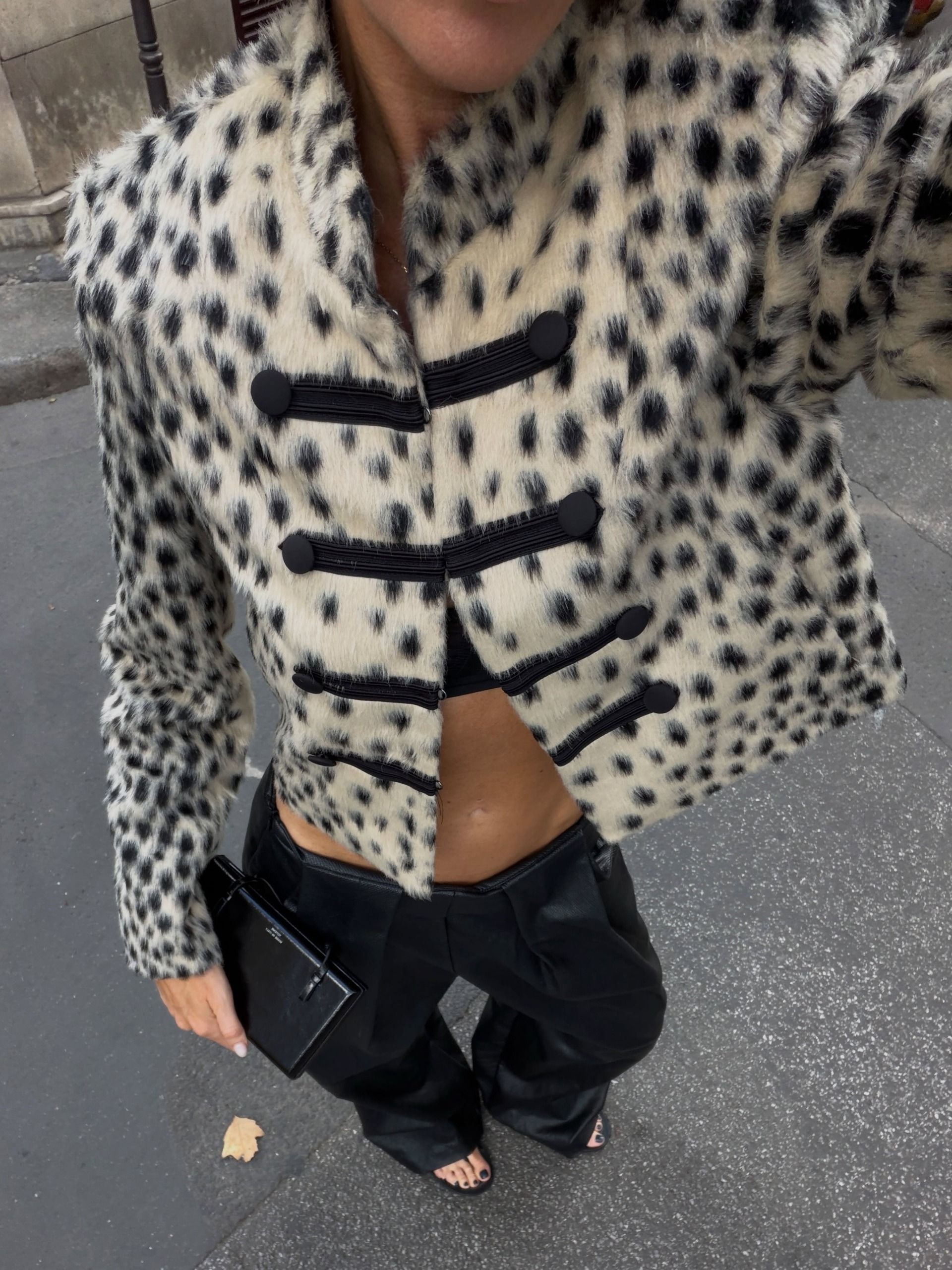 A woman wearing a fall leather-pant outfit in 2026.