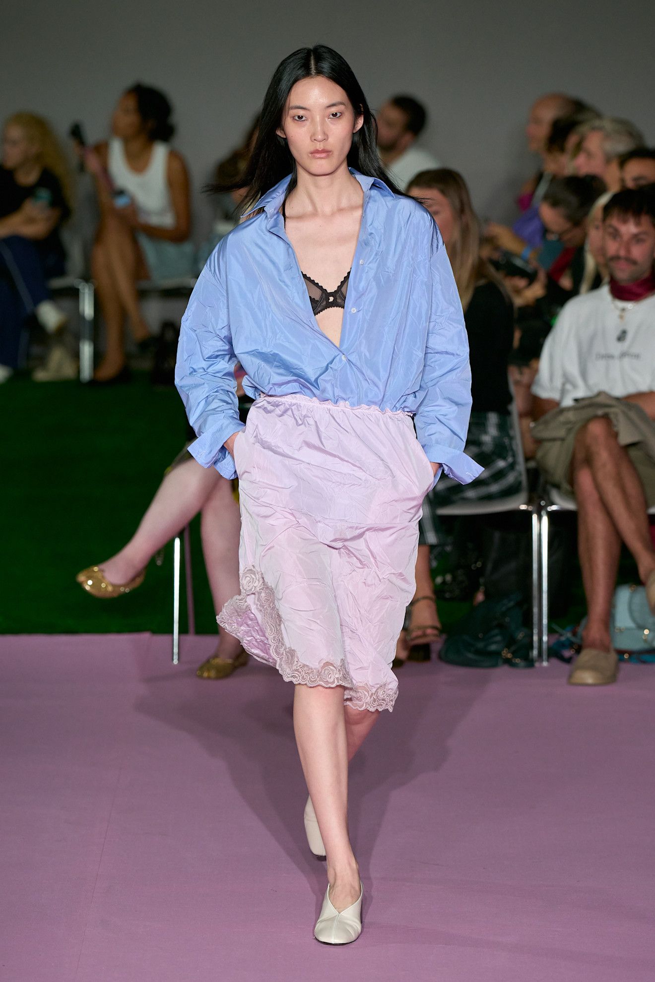 Spring/summer 2027 model wearing a bra top on the runway during fashion month.
