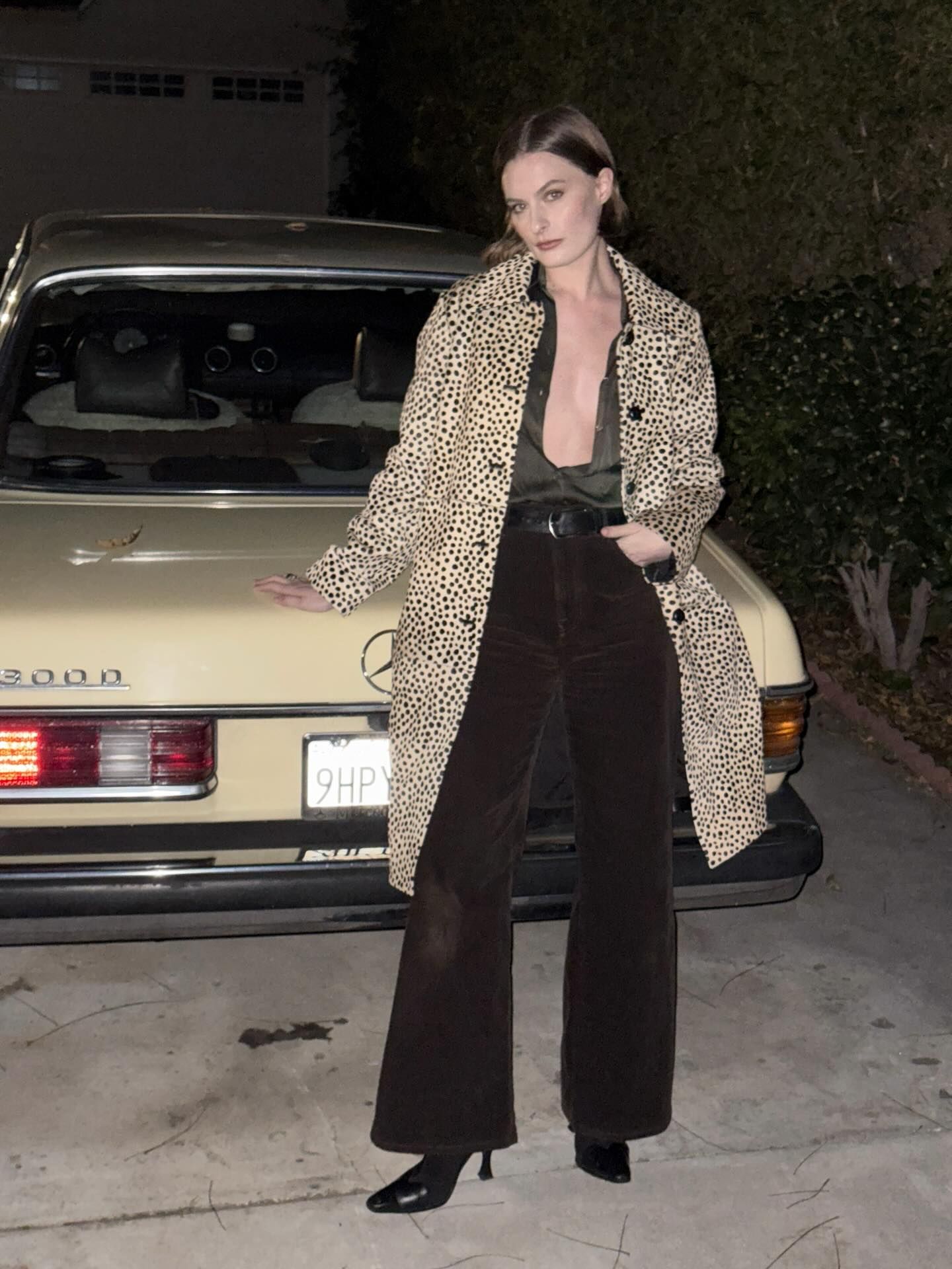 An image of an influencer wearing the R&oacute;he pony hair cheetah print coat with brown corduroy trousers and black heeled boots