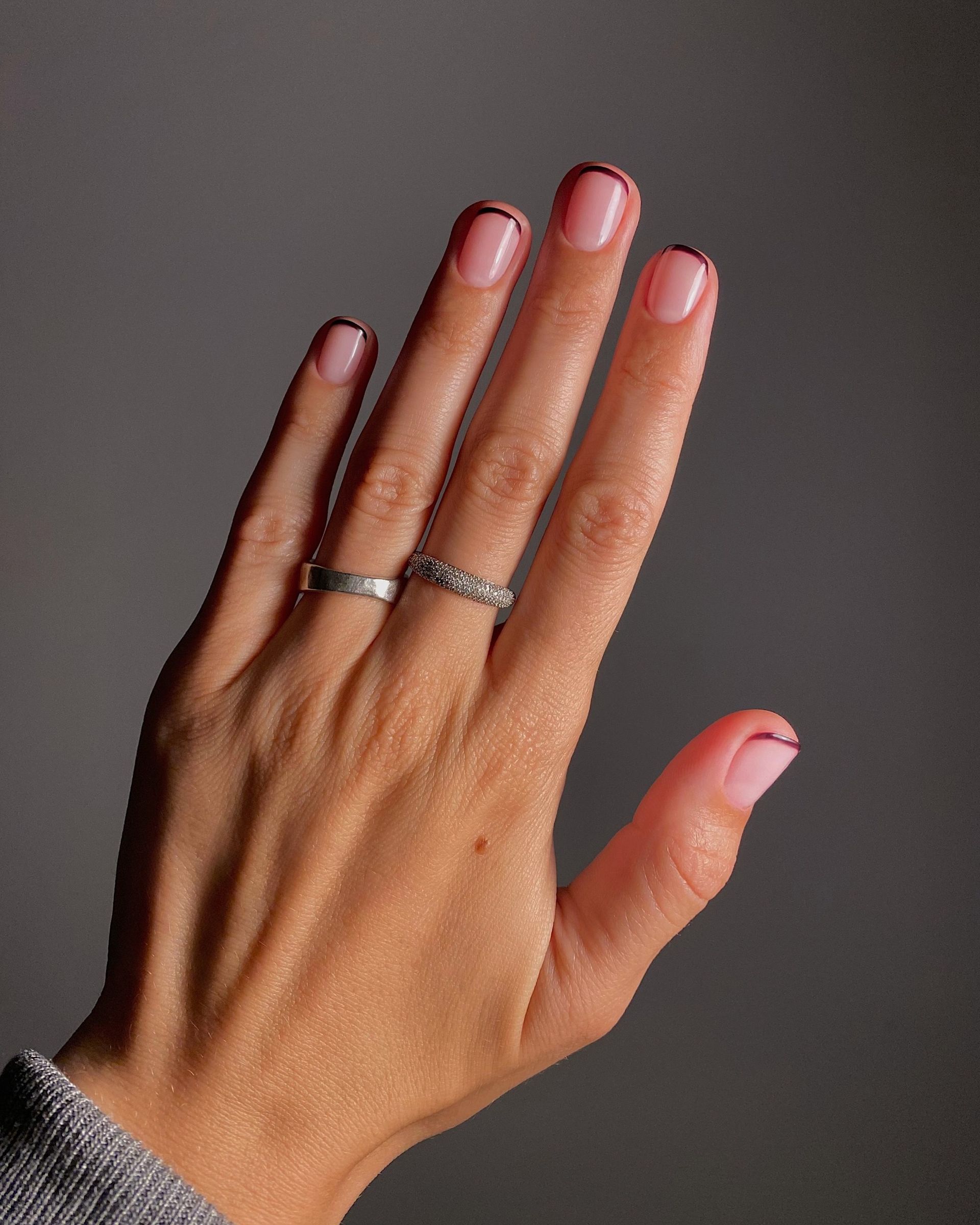 A picture of grape French tip nails
