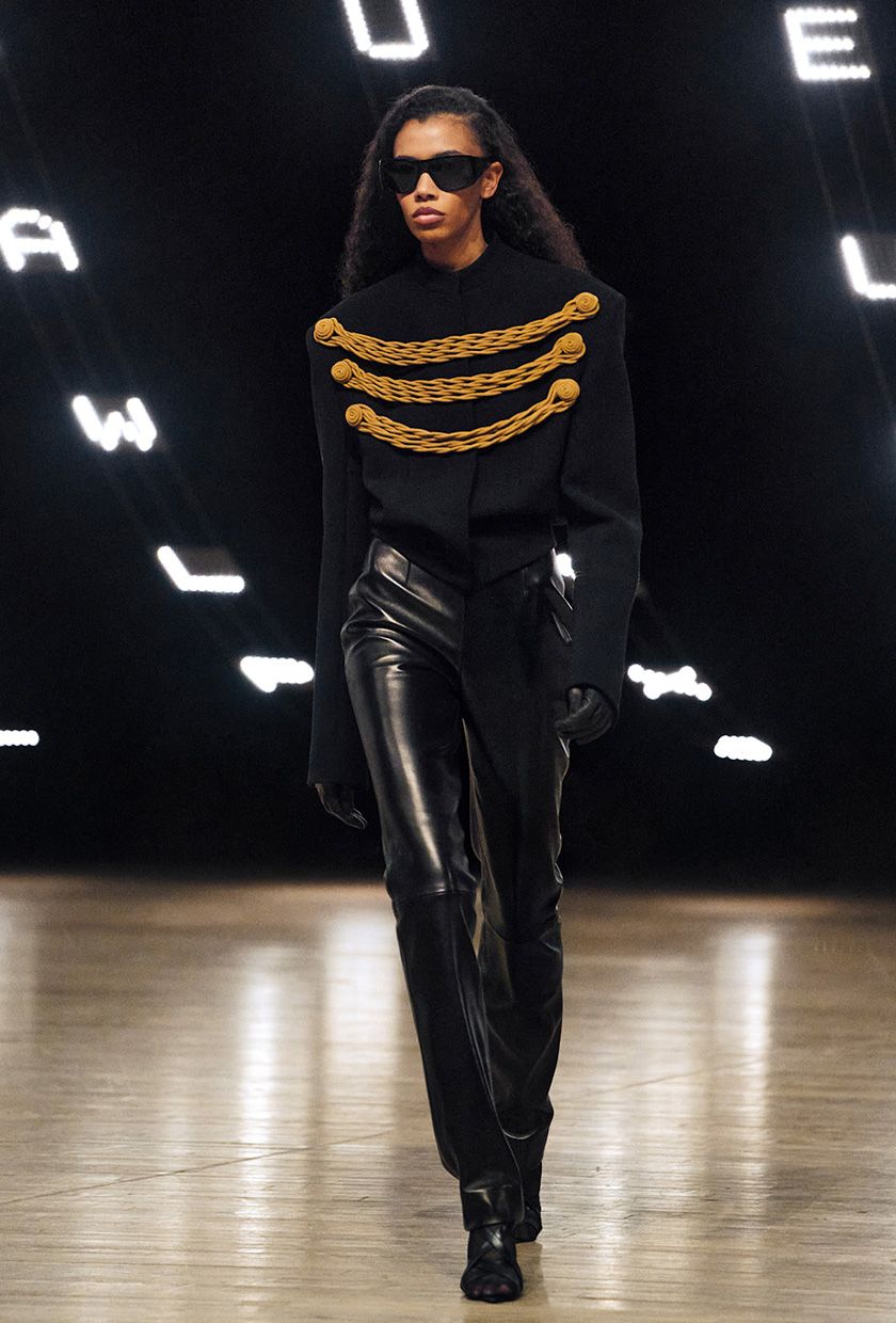 Khaite F/W 26 model wearing a military jacket with leather pants.