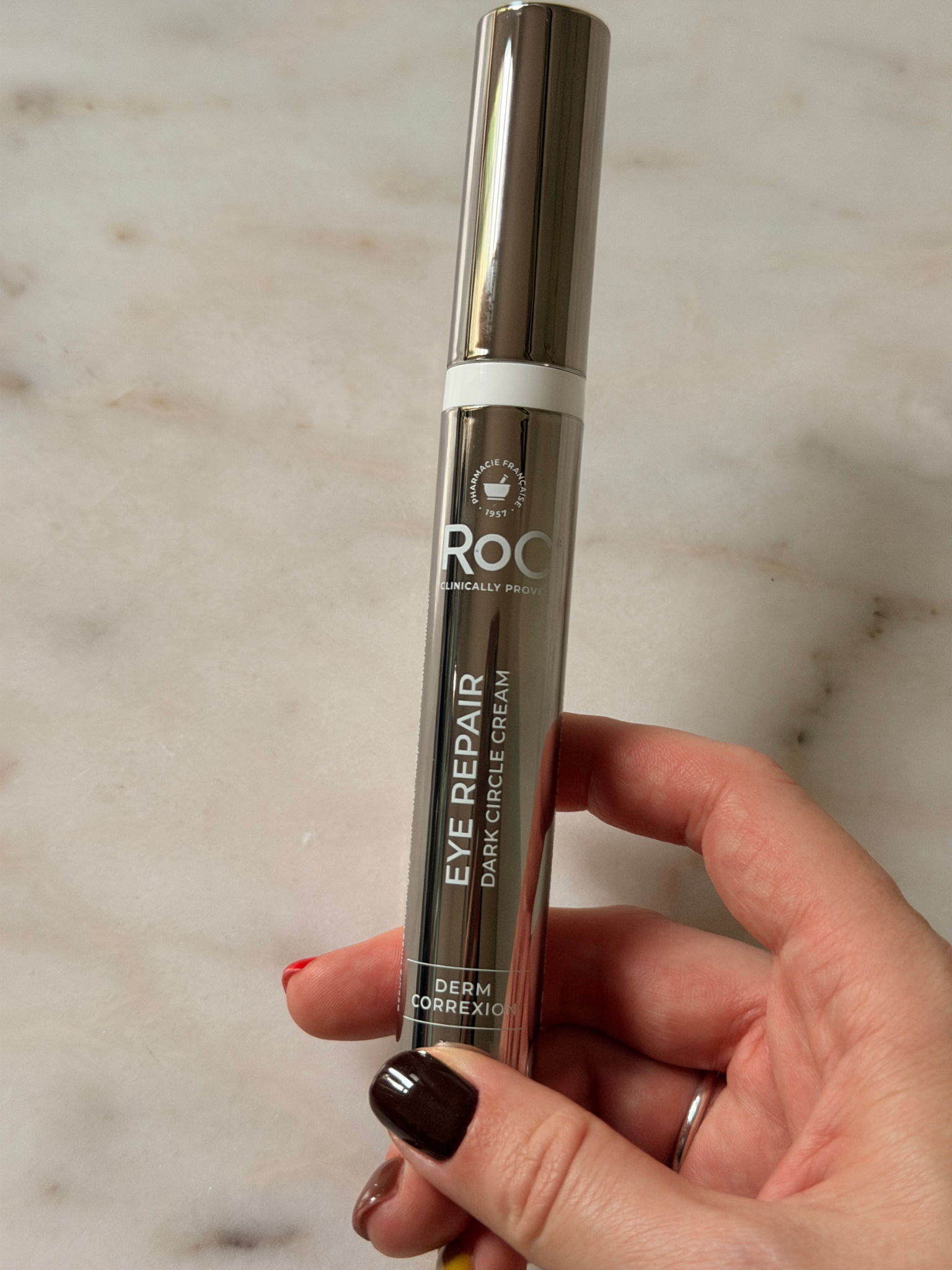 Freelance beauty editor Grace Day holding the RoC eye cream