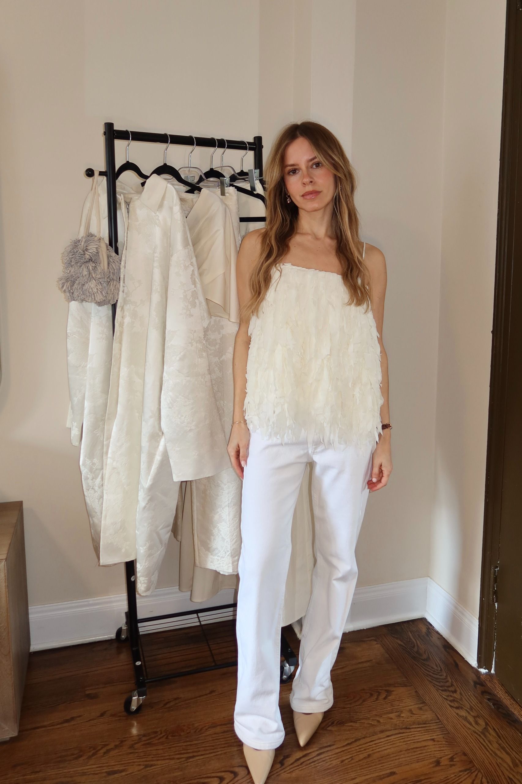 nikki tries on a dress from the st. agni bridal edit.