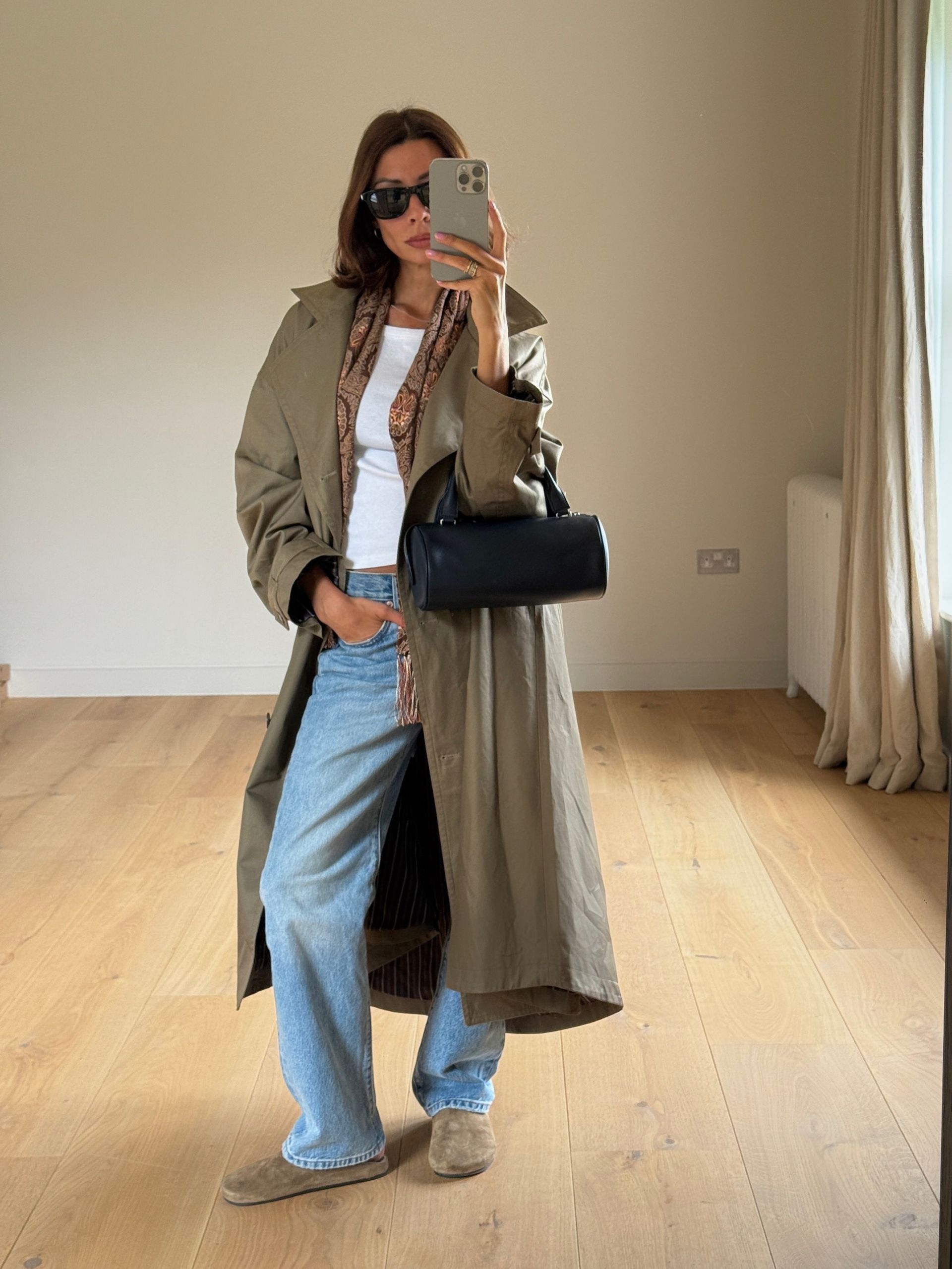 Woman in jeans and a cardigan