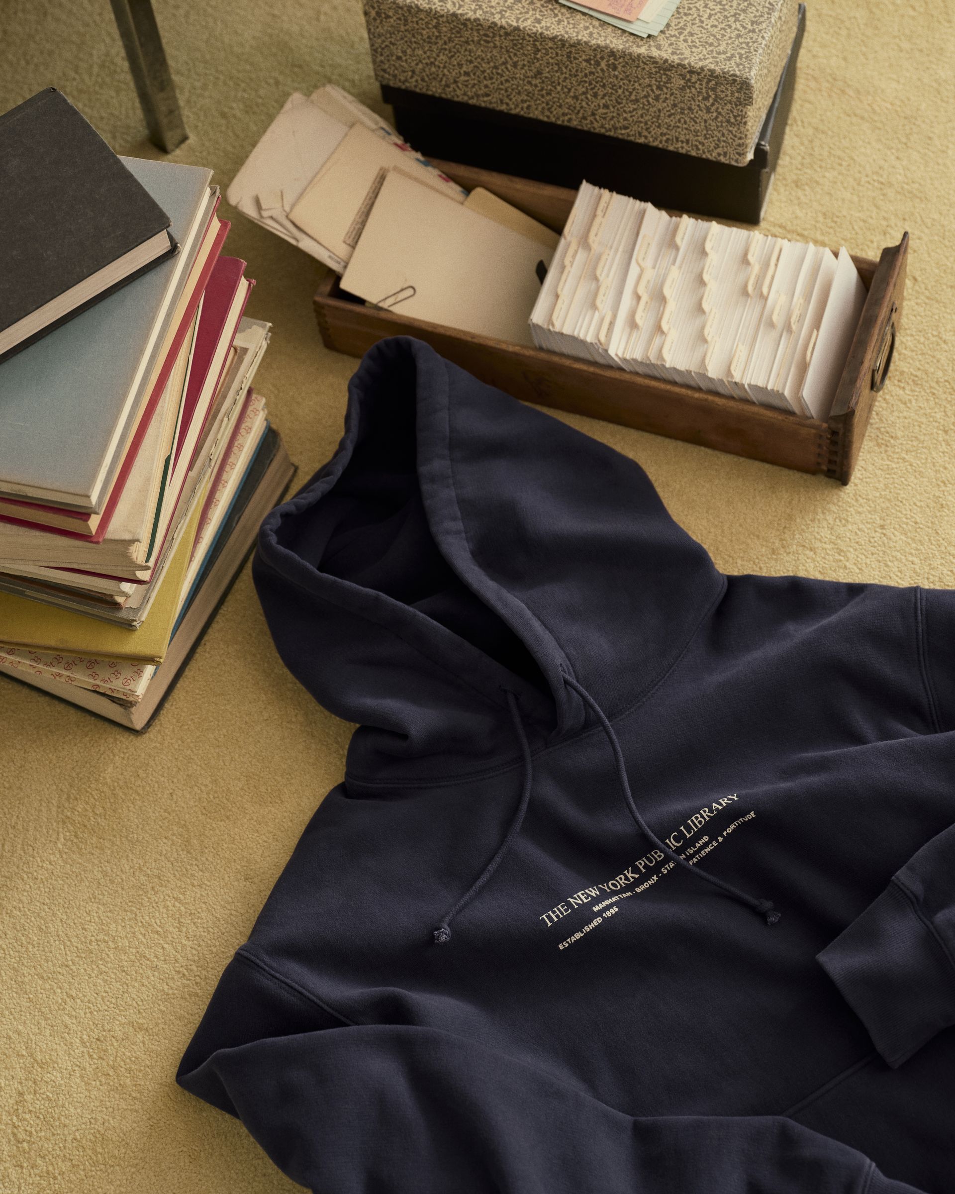 authors pose in pieces from the Madewell x New York Public Library collaboration