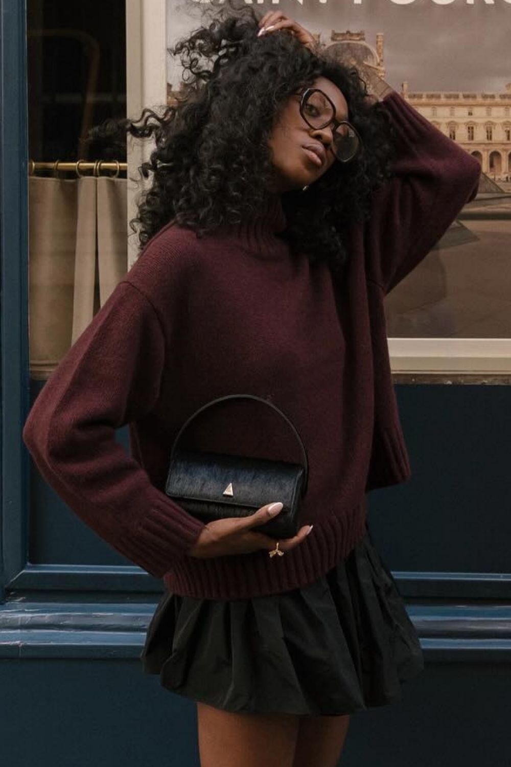 a close-up shot of an afro hairstyle worn with glasses